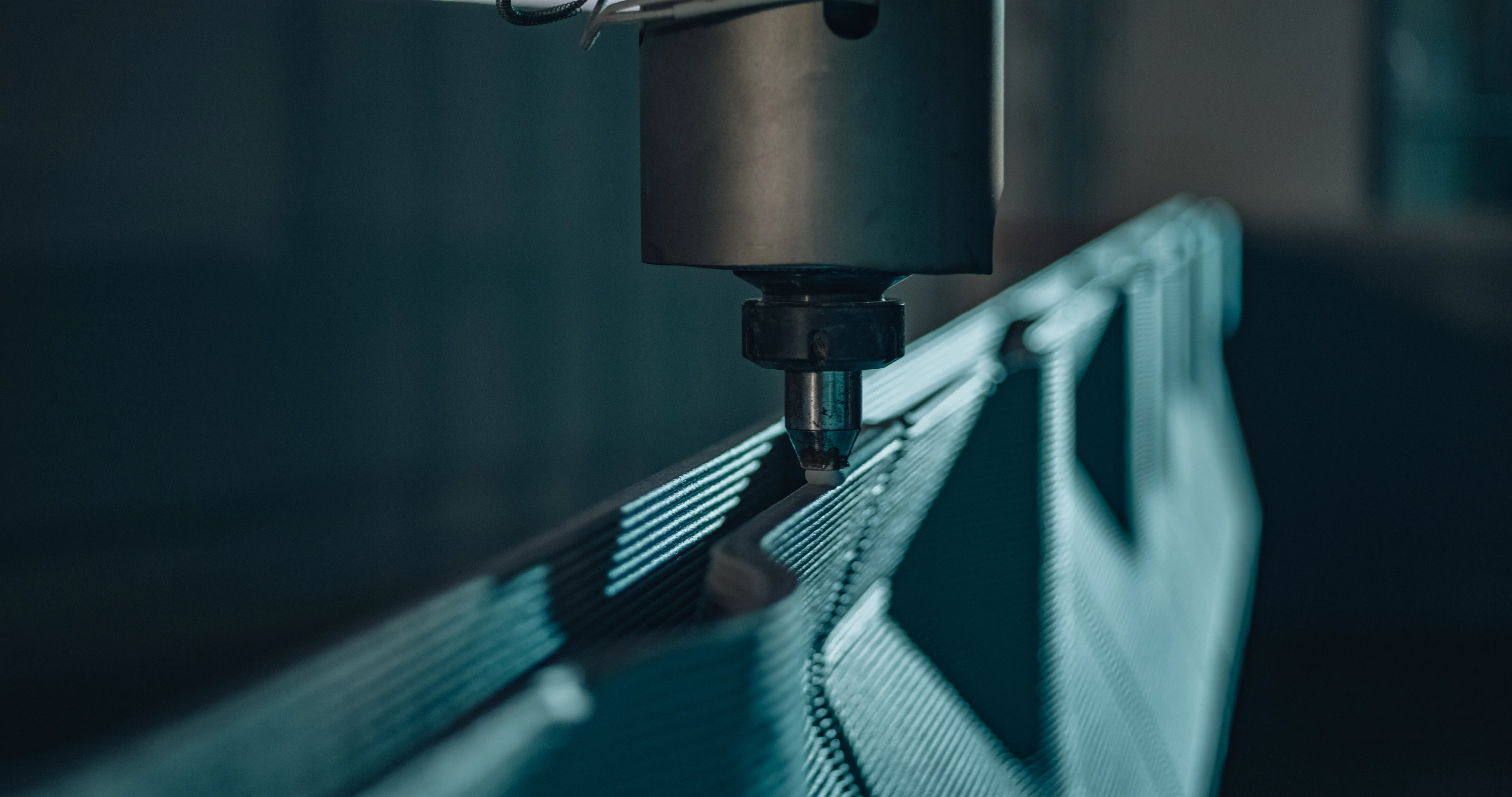 Azure 3D-printer nozzle extruding a recycled-polymer home wall, layer by layer