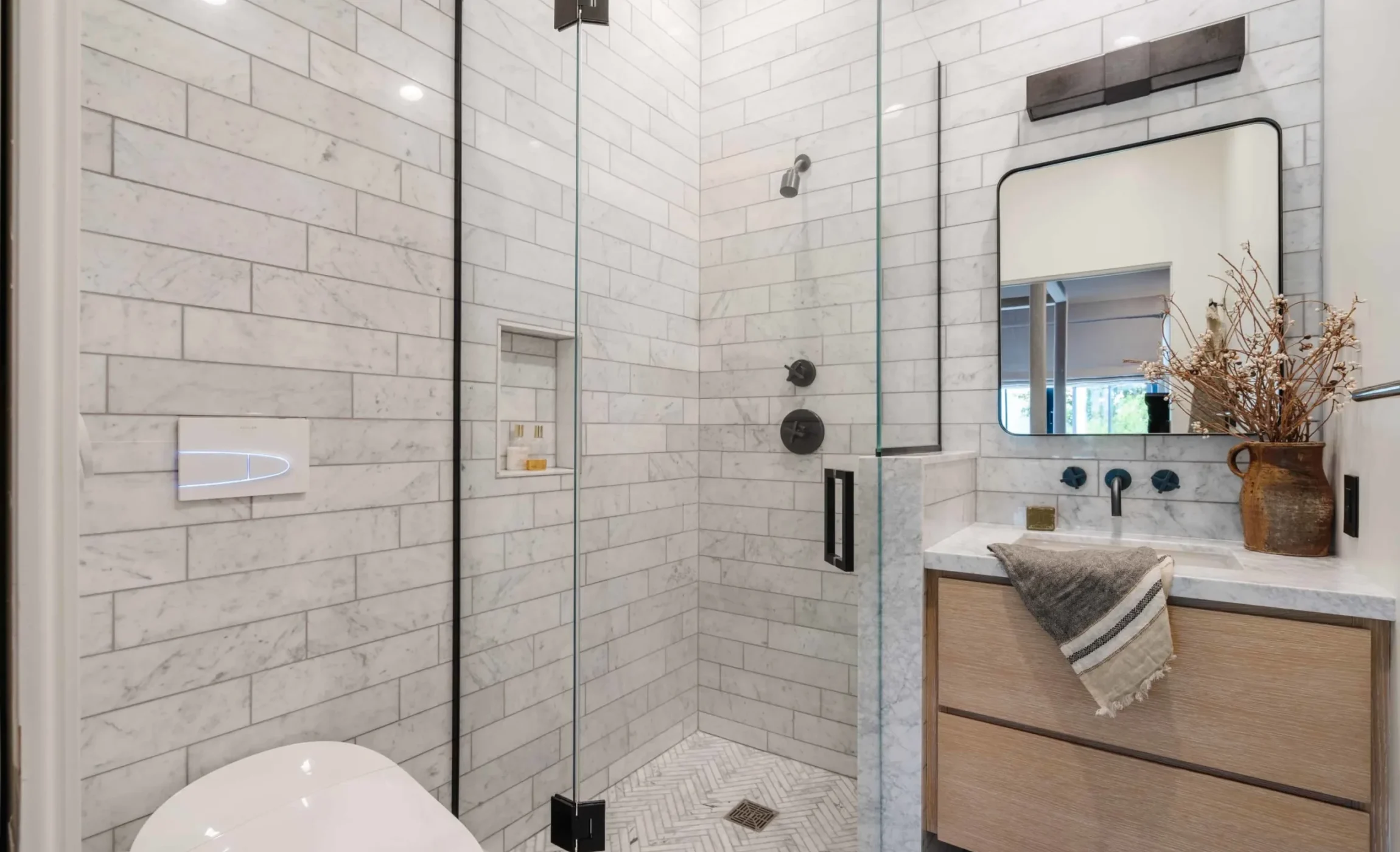 Marble bathroom with a walk-in shower in an Azure home