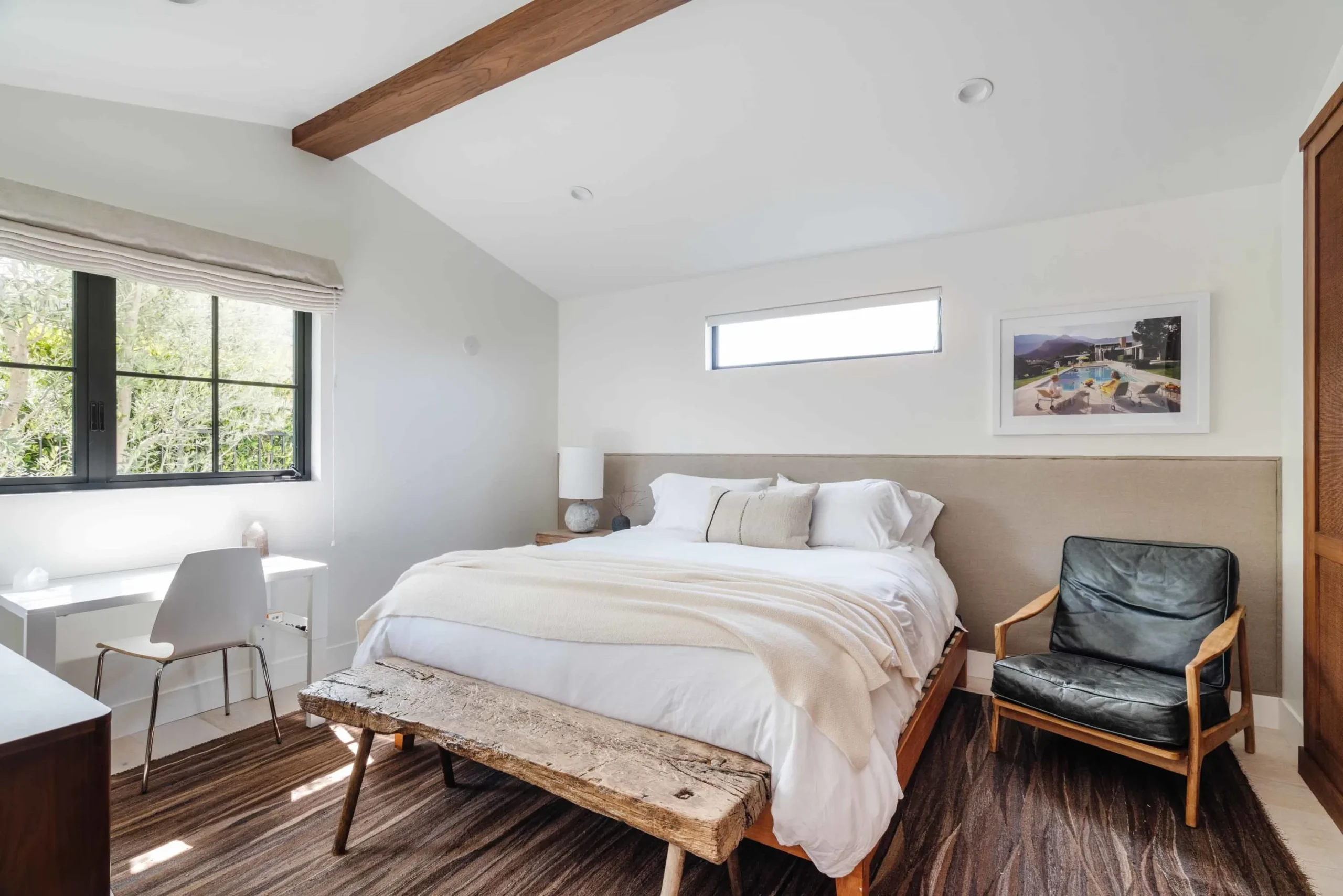 Master bedroom with a vaulted ceiling in an Azure home