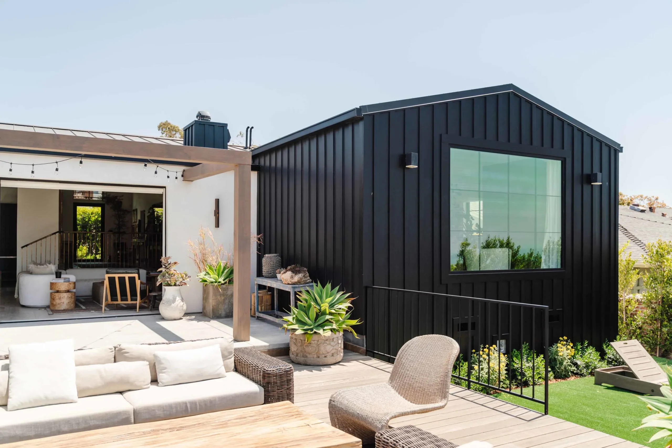 Real Azure two-bedroom modular home with a patio and pergola in daylight